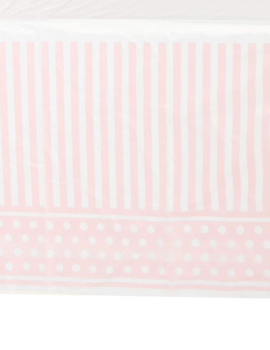 Détail des motifs de la nappe en plastique rayé et à pois pour fête rose et blanc