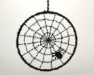 Rundes, schwarzes Spinnennetz