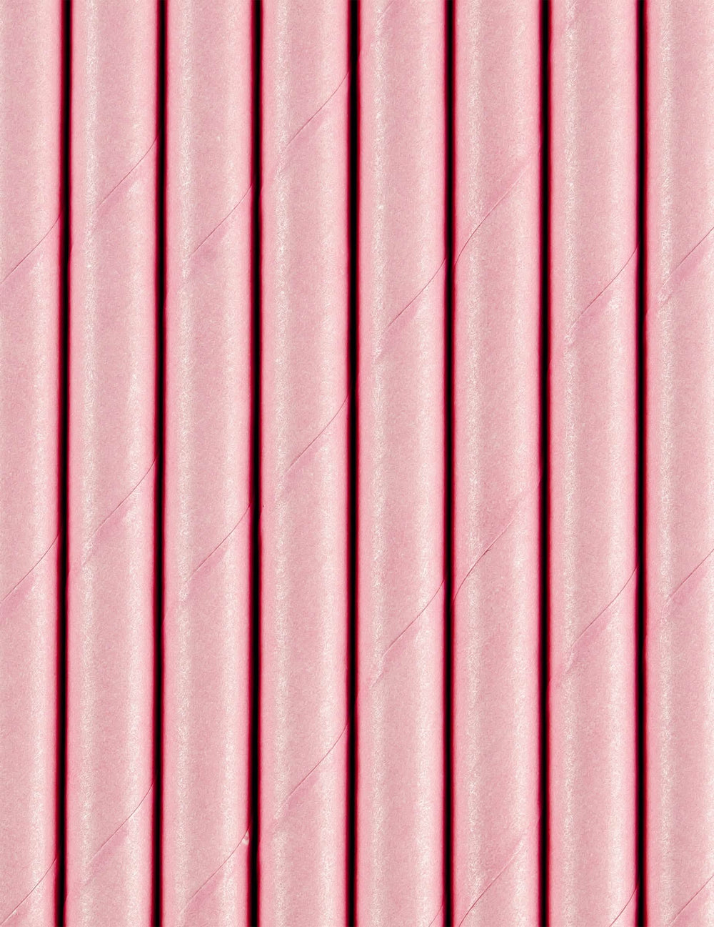 Gros plan sur la texture des pailles en carton rose clair pour fête