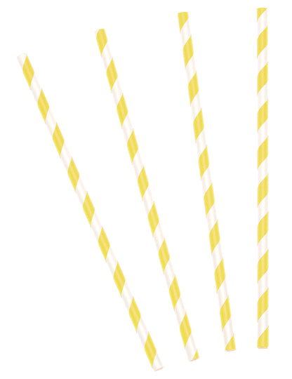 Mise en scène festive sur une table des pailles en carton rayées pour cocktails