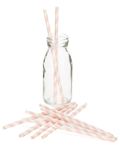 Mise en situation dans une bouteille des pailles en carton rayées pour boissons froides rose et blanc