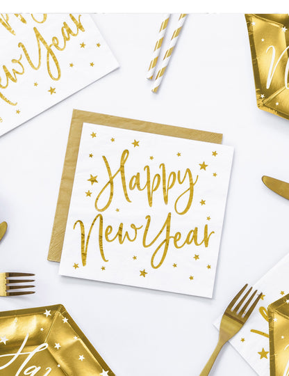 Vue de dessus des serviettes en papier Happy New Year blanches et dorées à étoiles