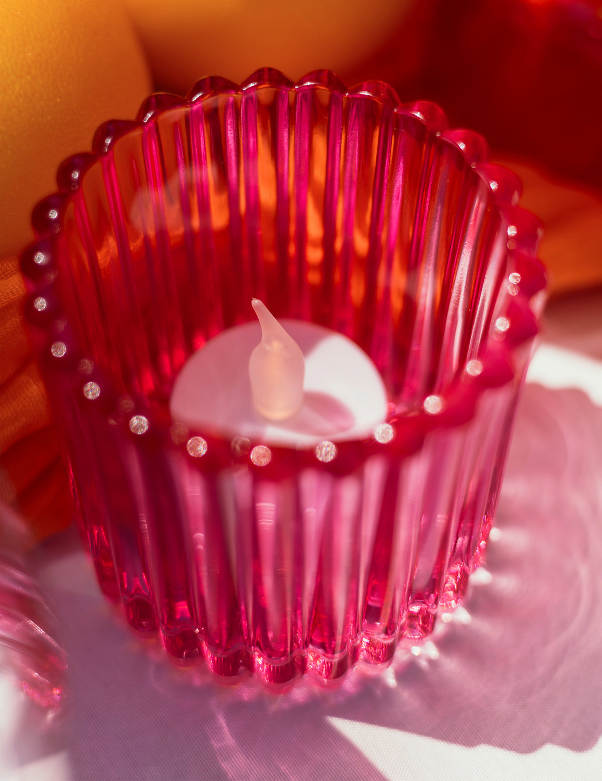 3 Windlichter aus Glas in Rosa, Orange und Gelb