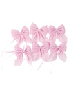 Nœuds en mousseline scintillante rose avec attaches