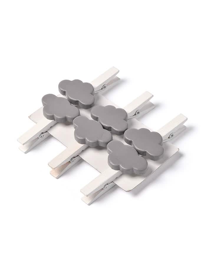 Vue de dessus du lot de pinces nuage pour décoration grises en bois blanc