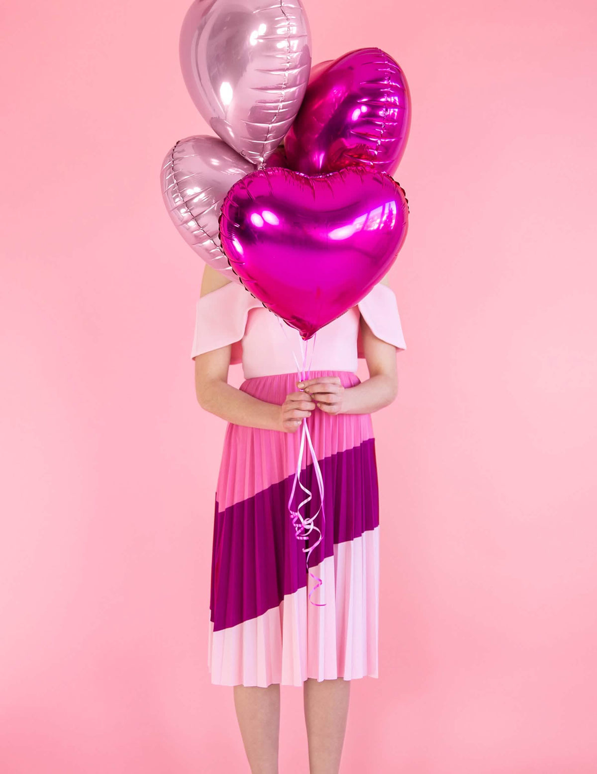 Mise en situation en bouquet du ballon coeur rose brillant