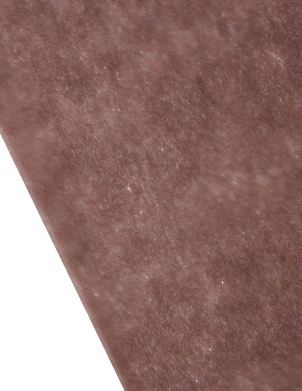 Gros plan sur la texture du chemin de table intissé décoration festive marron