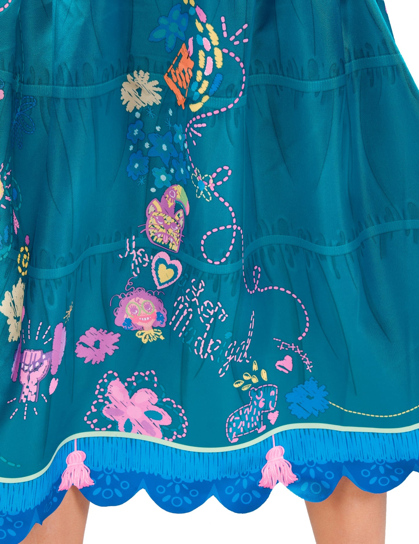 Détail des motifs et des pompons roses du déguisement Mirabel Encanto™ classique